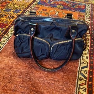 Classic MZ Wallace black purse. Gold tone hardware.